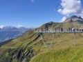 Grindelwald First, Switzerland. An adventure in the mountains.The dizzying footbridge at the edge of the abyss.