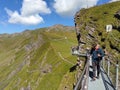 Grindelwald First, Switzerland. An adventure in the mountains.The dizzying footbridge at the edge of the abyss.