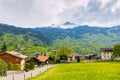 Grindelwald valley with village scattered on the green slopes o Royalty Free Stock Photo