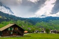 Grindelwald valley with village scattered on the green slopes o Royalty Free Stock Photo