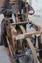 Grinder with large hands sharpen a blade of a knife