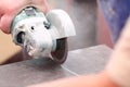 Grinder worker cuts a stone the electric tool Royalty Free Stock Photo