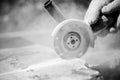 Grinder worker cuts a stone Royalty Free Stock Photo