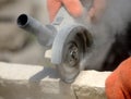 Grinder worker cuts a stone Royalty Free Stock Photo
