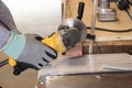 Grinder worker cuts a stone the electric tool worker is tiling at home Royalty Free Stock Photo