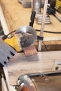 Grinder worker cuts a stone the electric tool worker is tiling at home Royalty Free Stock Photo