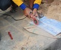 Grinder worker cuts a stone the electric tool worker is tiling a Royalty Free Stock Photo