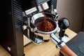 Grinding coffee bean in to portafilter coffee basket