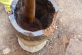 Grinding coffee in a mortar in Chagga tribe Royalty Free Stock Photo