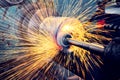 Grinding a cylindrical part on a circular grinding machine, high-precision abrasive grinding with sparks Royalty Free Stock Photo