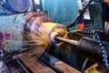 Grinding a cylindrical part on a circular grinding machine, high-precision abrasive grinding with sparks Royalty Free Stock Photo