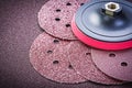 Grinding discs holder on sandpaper sheet abrasive materials Royalty Free Stock Photo