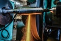 Grinding on the machine, high-precision machining of parts with an abrasive wheel on a circular grinding machine with cooling Royalty Free Stock Photo