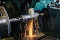 Grinding on the machine, high-precision machining of parts with an abrasive wheel on a circular grinding machine with cooling Royalty Free Stock Photo