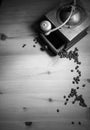 Grinding roasted beans of coffee with old vintage retro grinder with ground coffee in black and whit Royalty Free Stock Photo