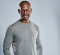 Grinning African man in gray shirt with copy space