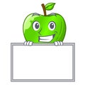 Grinning with board cartoon of big shiny green apple Royalty Free Stock Photo