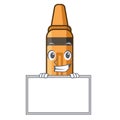 Grinning with board orange crayon above the mascot book Royalty Free Stock Photo