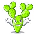 Grinning cartoon opuntia cactus in the desert