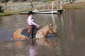 Grinning Cowgirl Crossing Pond Royalty Free Stock Photo