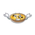Grinning spanish paella cooked in cartoon skillet