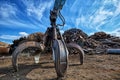 Gripper excavator on a scrap yard. Royalty Free Stock Photo