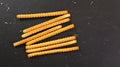 Grissini, also known as breadsticks on black marble like table, view from above Royalty Free Stock Photo