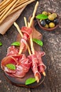 Grissini bread sticks with ham