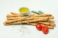 Grissini breadsticks with spices on white background Royalty Free Stock Photo