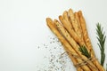 Grissini breadsticks with spices on white background Royalty Free Stock Photo