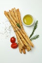 Grissini breadsticks with spices on white background Royalty Free Stock Photo