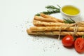Grissini breadsticks with spices on white background Royalty Free Stock Photo