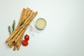 Grissini breadsticks with spices on white background Royalty Free Stock Photo