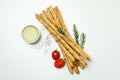 Grissini breadsticks with spices on white background Royalty Free Stock Photo