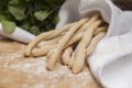 Grissini Thin Bread Sticks on wooden cutting board. Royalty Free Stock Photo