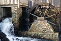 Grist mill and waterwheel for grain production Royalty Free Stock Photo