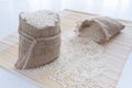 Grits white rice in a linen bag on the table close up