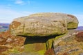 Gritsone rock perched precariously on Curbar Edge in Derbyshire