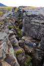 The fault that marks the continental separation in plate tectonics between Europe and America, above Grjotagja cave, Iceland.