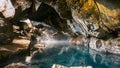 Grjotagja volcanic hot springs cave, near Reykjahlid, Myvatn, Iceland, with blue and transparent water.