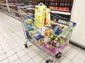 Groceries that have been picked up are placed in the cart before payment is made at the payment counter.