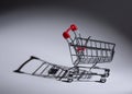 Grocery cart casting a shadow Royalty Free Stock Photo