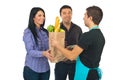 Grocery clerk giving bag to couple Royalty Free Stock Photo