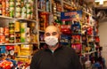 Grocery Employee wearing a mask due to covid-19