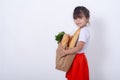 Grocery products in paper bag. Isolated on white wall. Kid with purchase Royalty Free Stock Photo