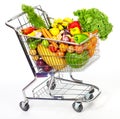 Grocery shopping cart with vegetables and fruits. Royalty Free Stock Photo