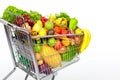 Grocery shopping cart with vegetables and fruits. Royalty Free Stock Photo