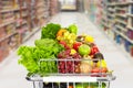 Grocery shopping cart with vegetables. Royalty Free Stock Photo