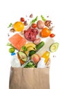 Grocery shopping concept. Balanced diet concept. Fresh foods with shopping bag on white background Royalty Free Stock Photo