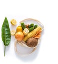 Grocery shopping with eco bag over white background. Zero waste and plastic free concept. Flat lay. Copy space Royalty Free Stock Photo